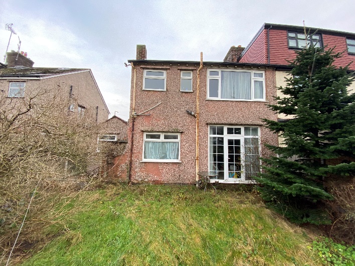 Tired rear elevation of a Wirral home before redesign
